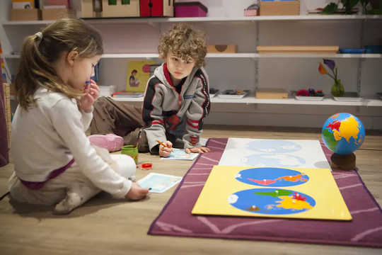 Children in Montessori classrooms, like this one in France, often team up for their activities